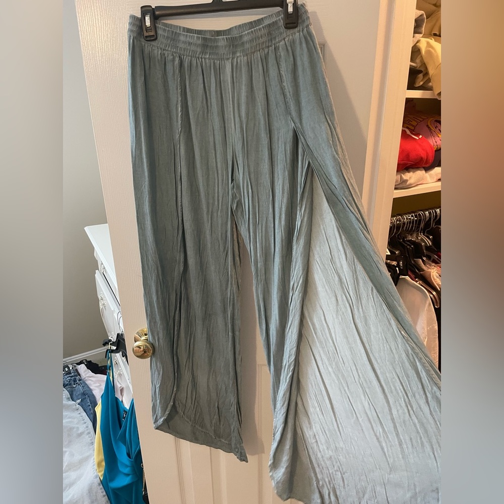 Turquoise flowy pants with slit all the way down the front on both legs